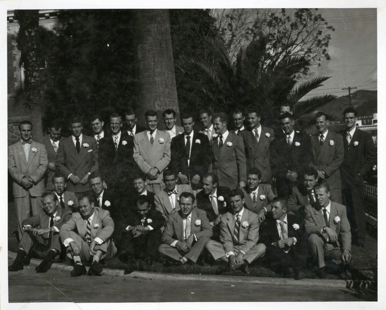A group of men in suits and ties posing for a picture.