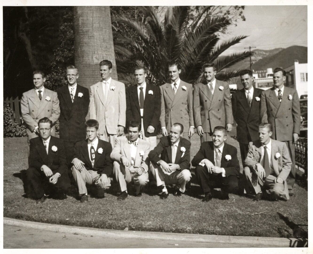 A group of men in suits posing for a picture.