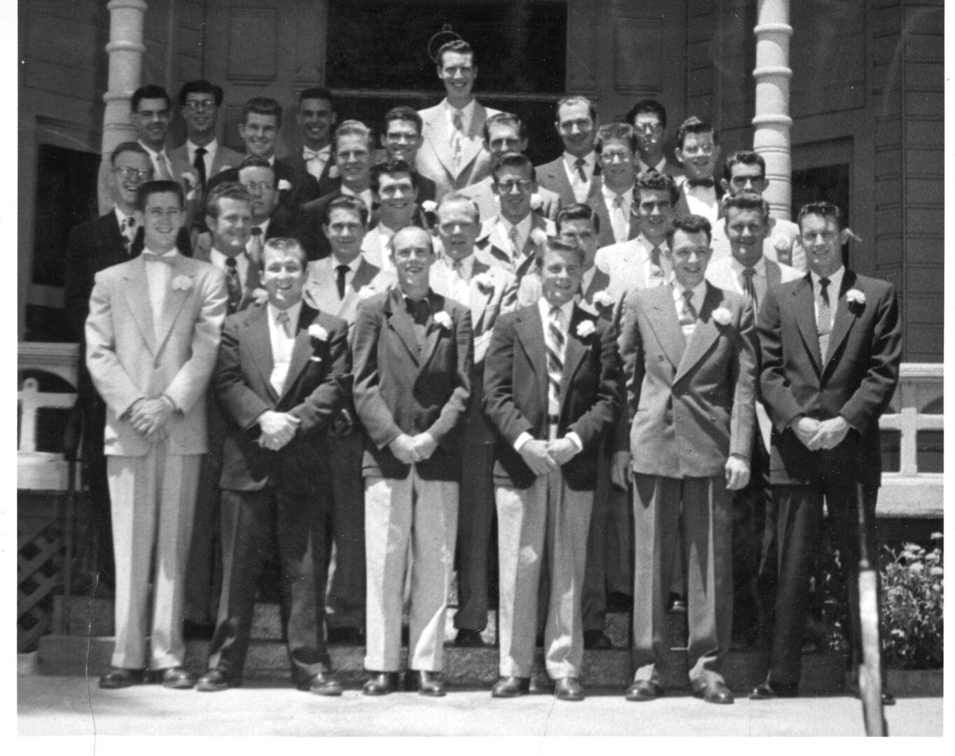 A group of men in suits and ties standing together.
