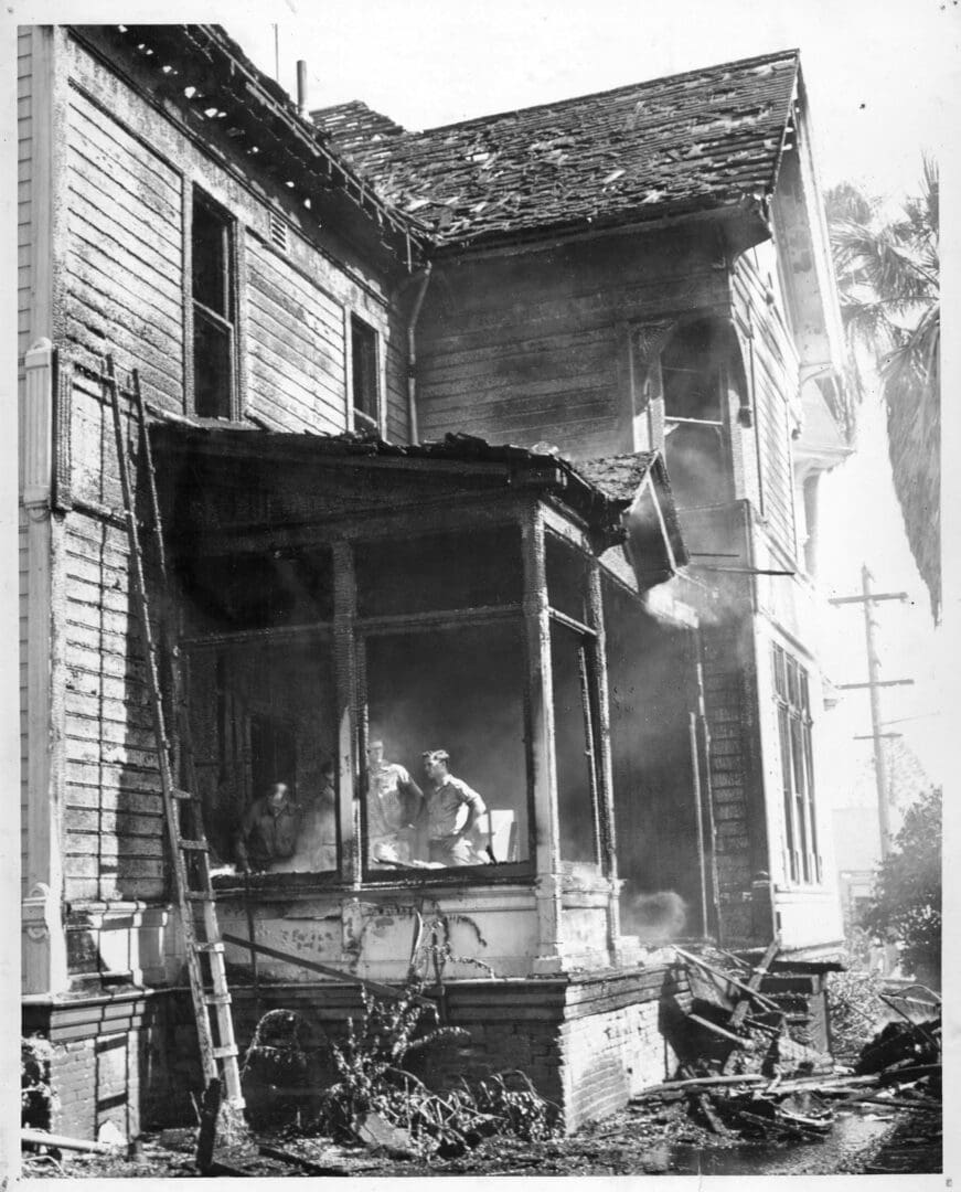 A fire that is burning in the middle of an old building.