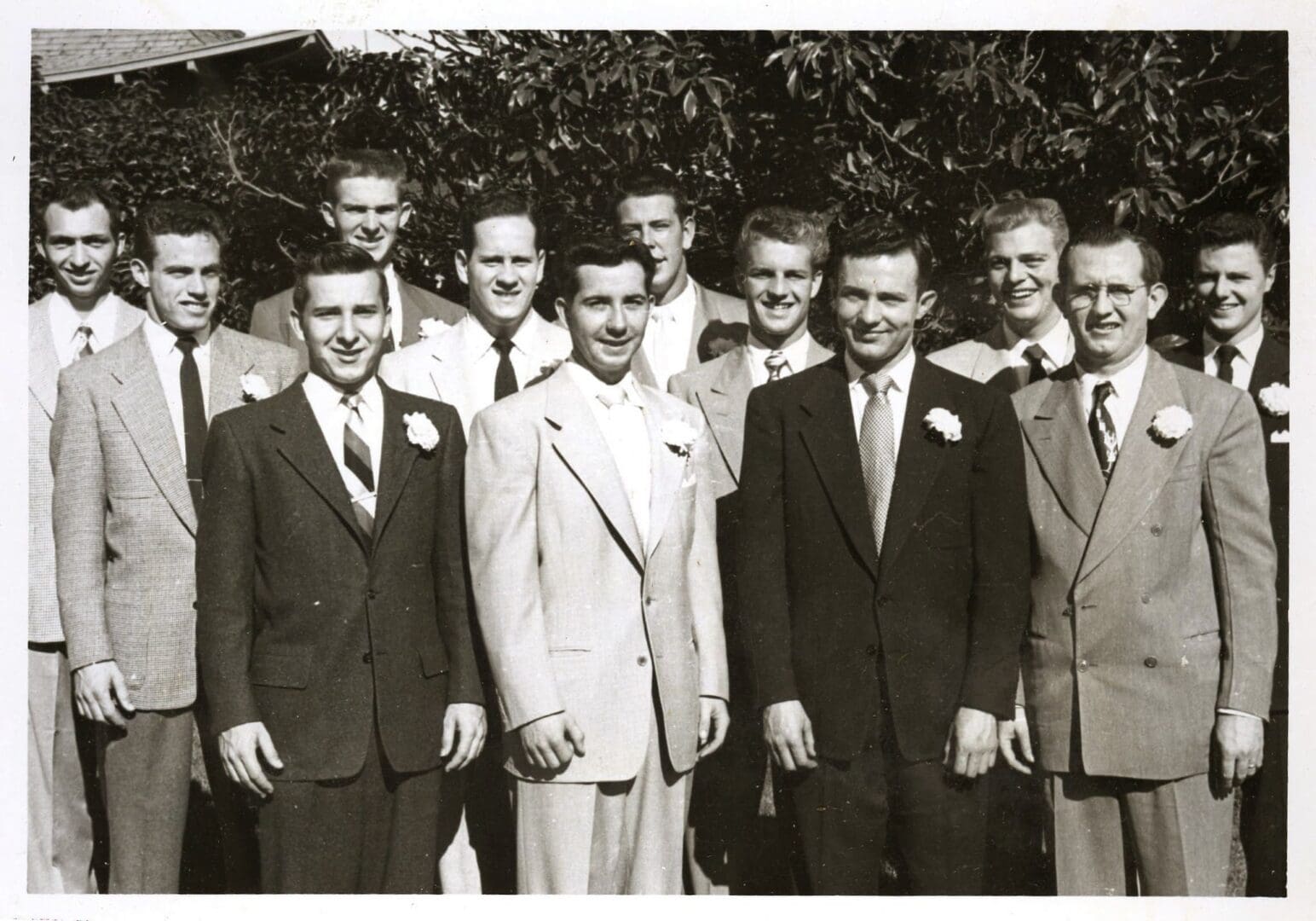 A group of men in suits and ties posing for the camera.
