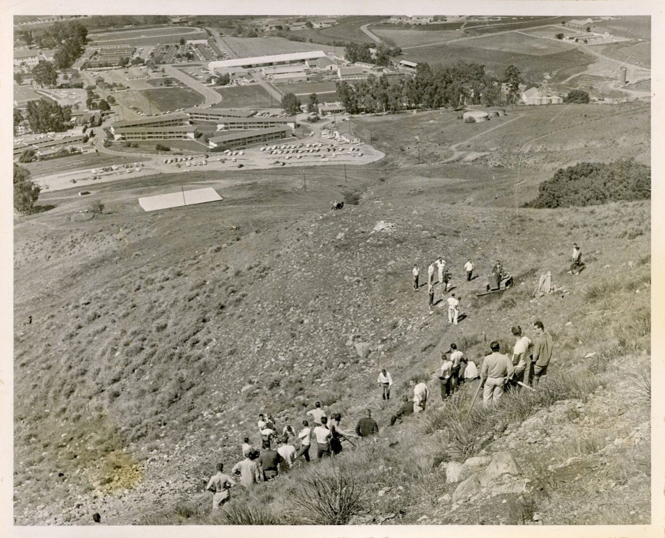 A group of people walking up a hill