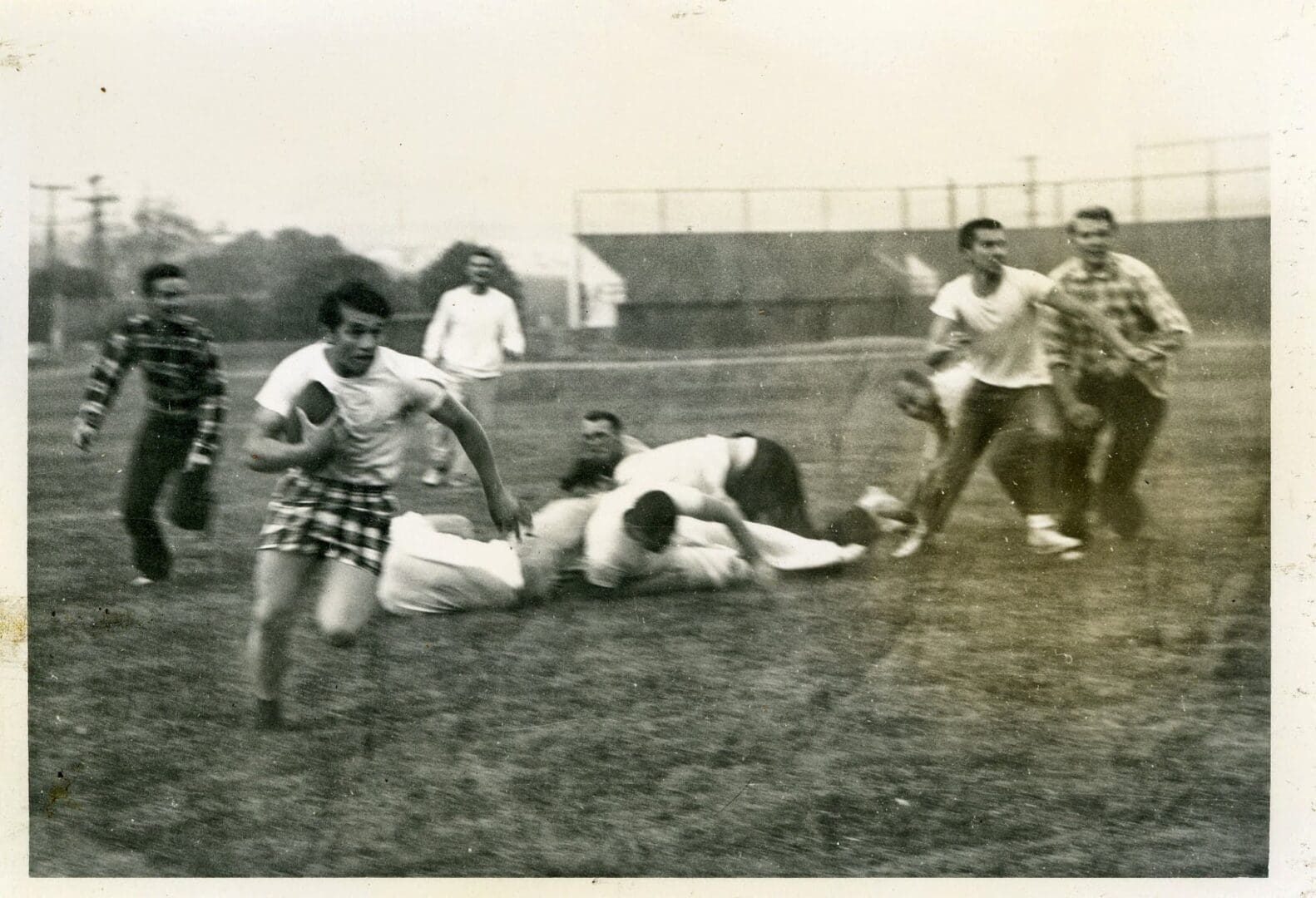 A group of men playing baseball on the grass.