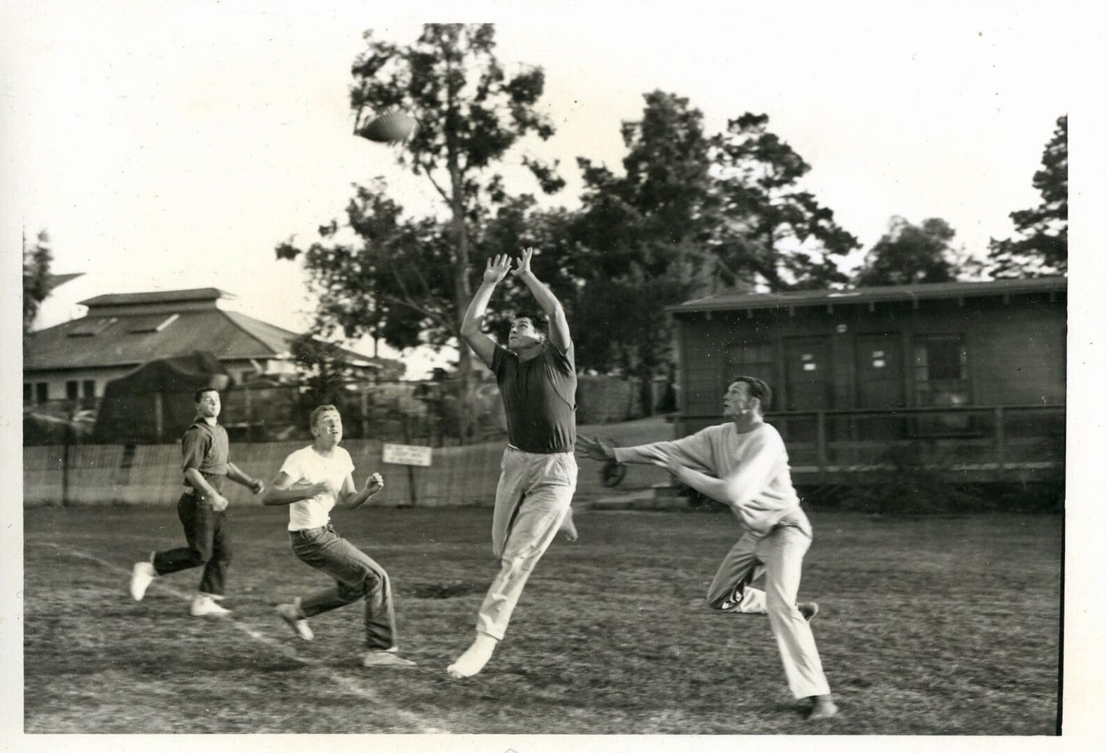 A group of people playing baseball on the field.