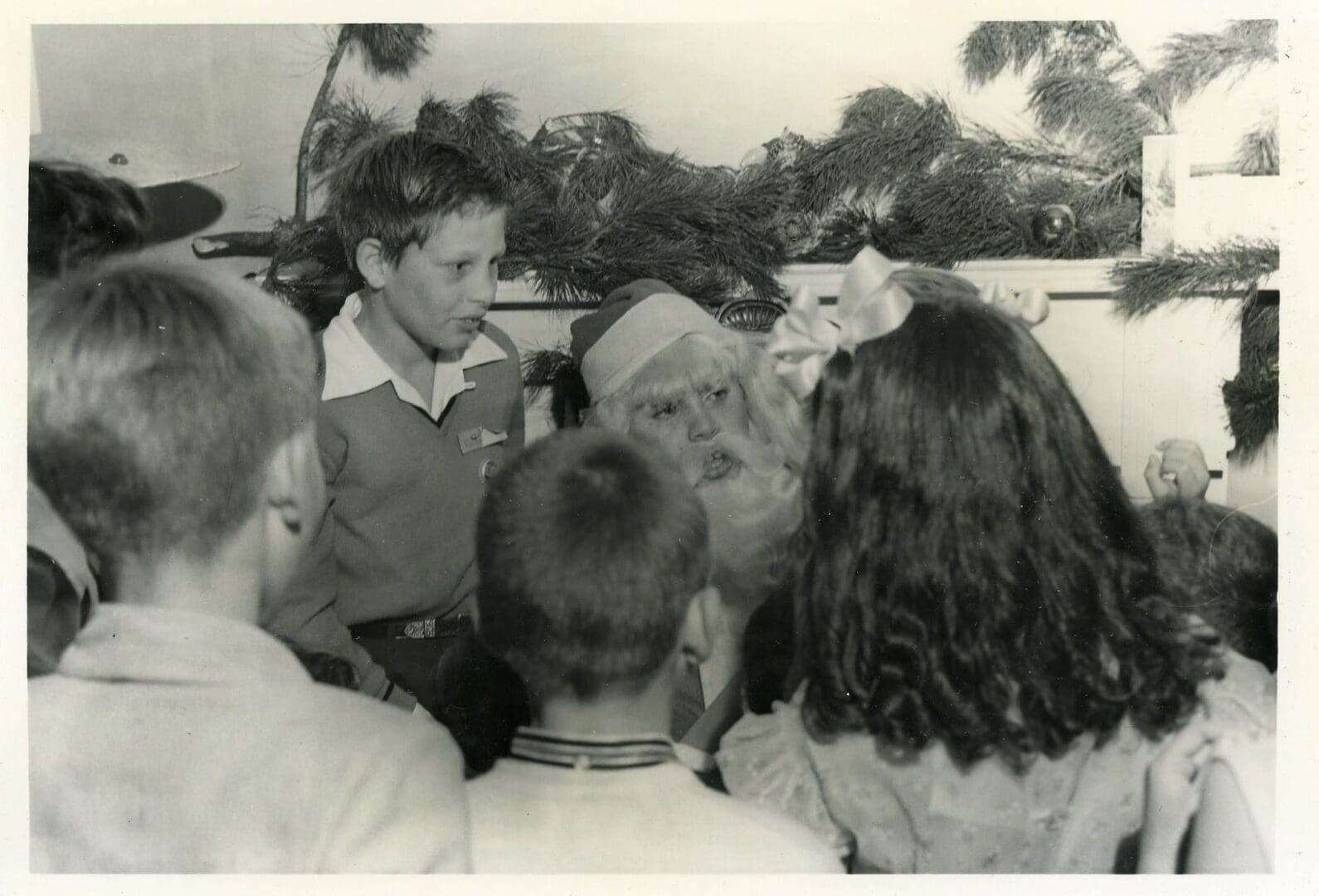 A group of people gathered around each other.