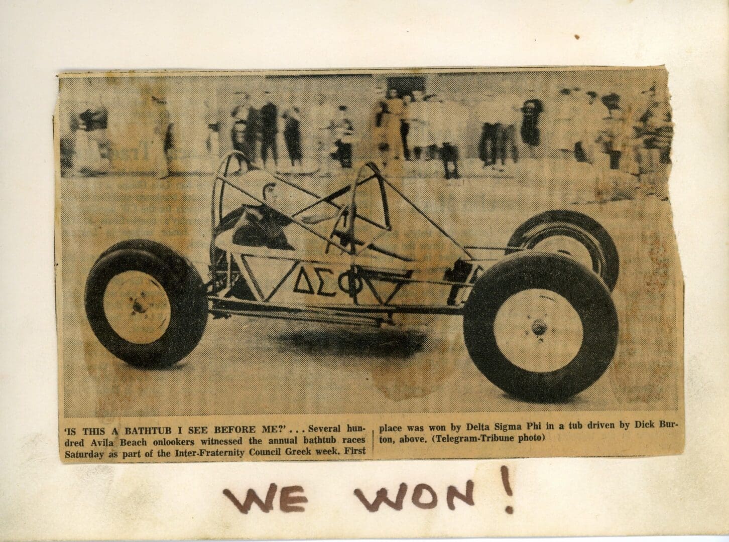 A picture of an old race car with the words " we won !" written on it.