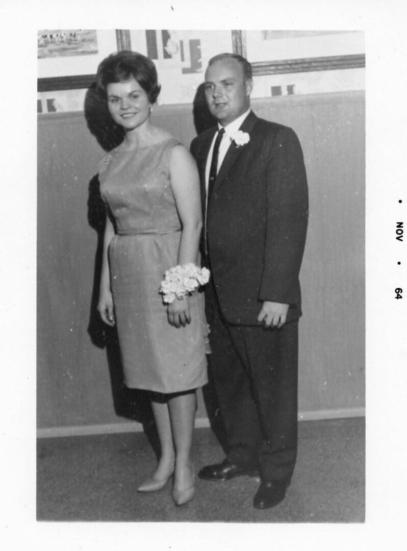 A man and woman standing next to each other.