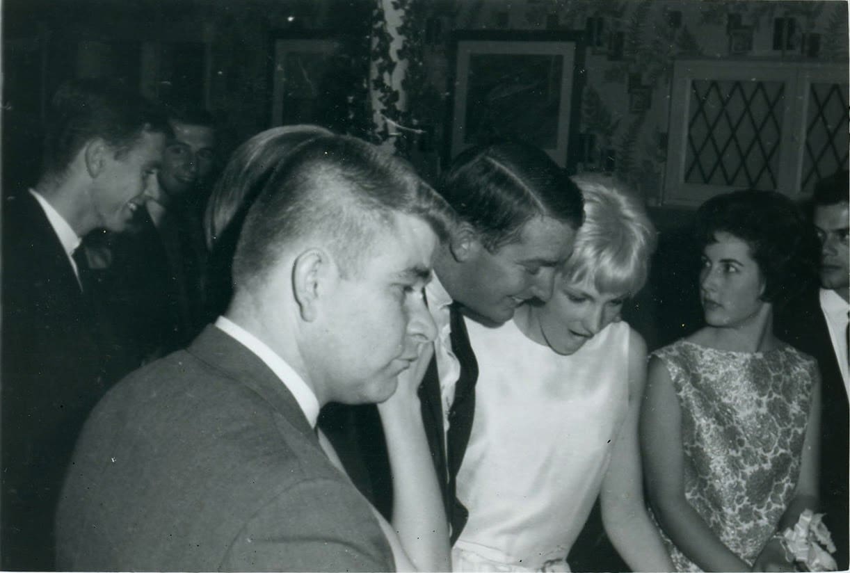 A man and woman are standing next to each other.