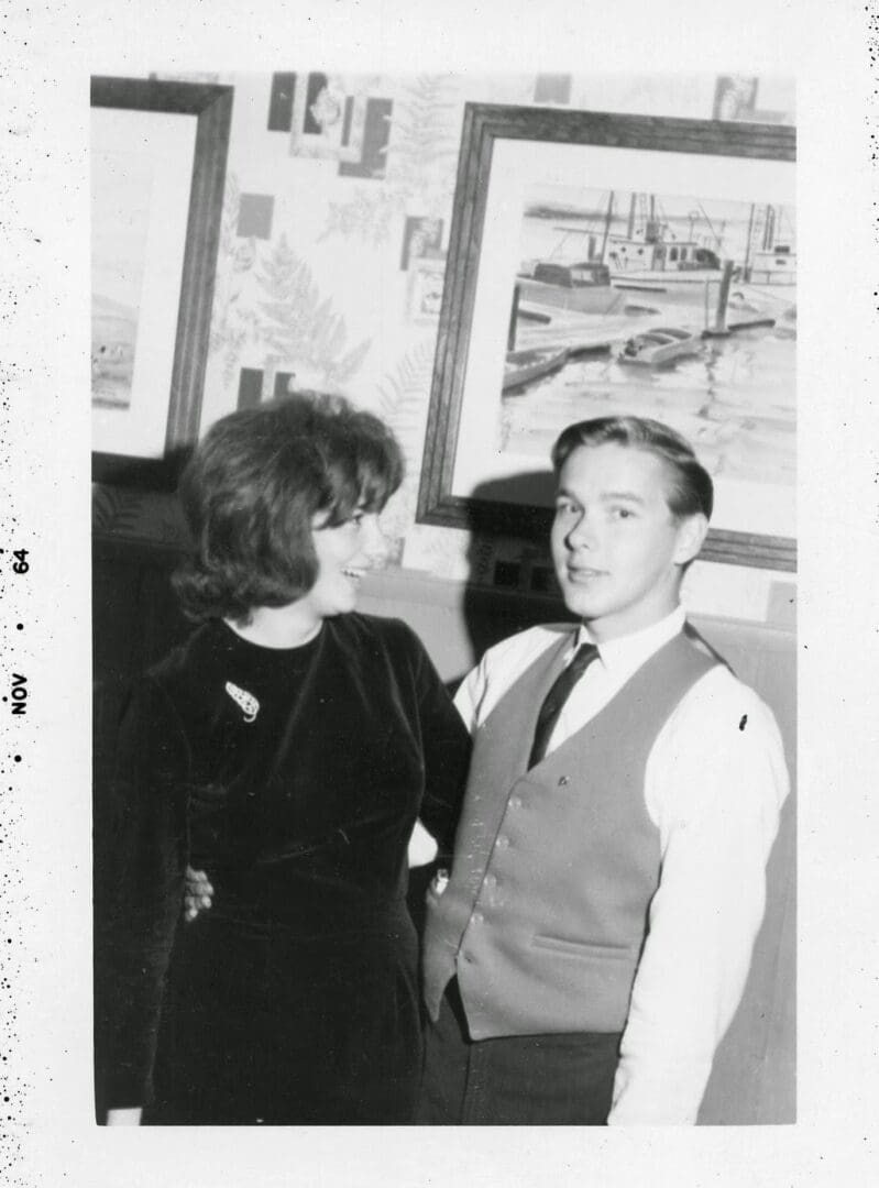 A man and woman standing next to each other.