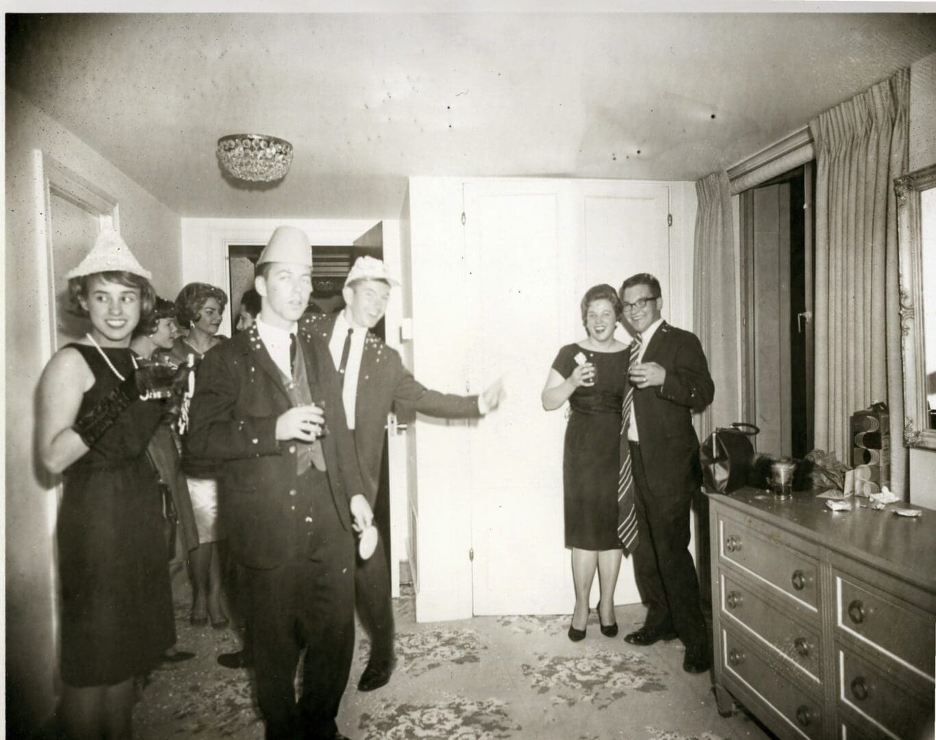 A group of people standing in a room.