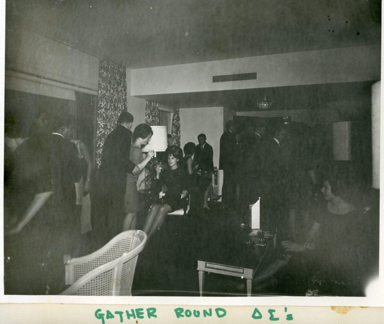 A group of people gathered in an old room.