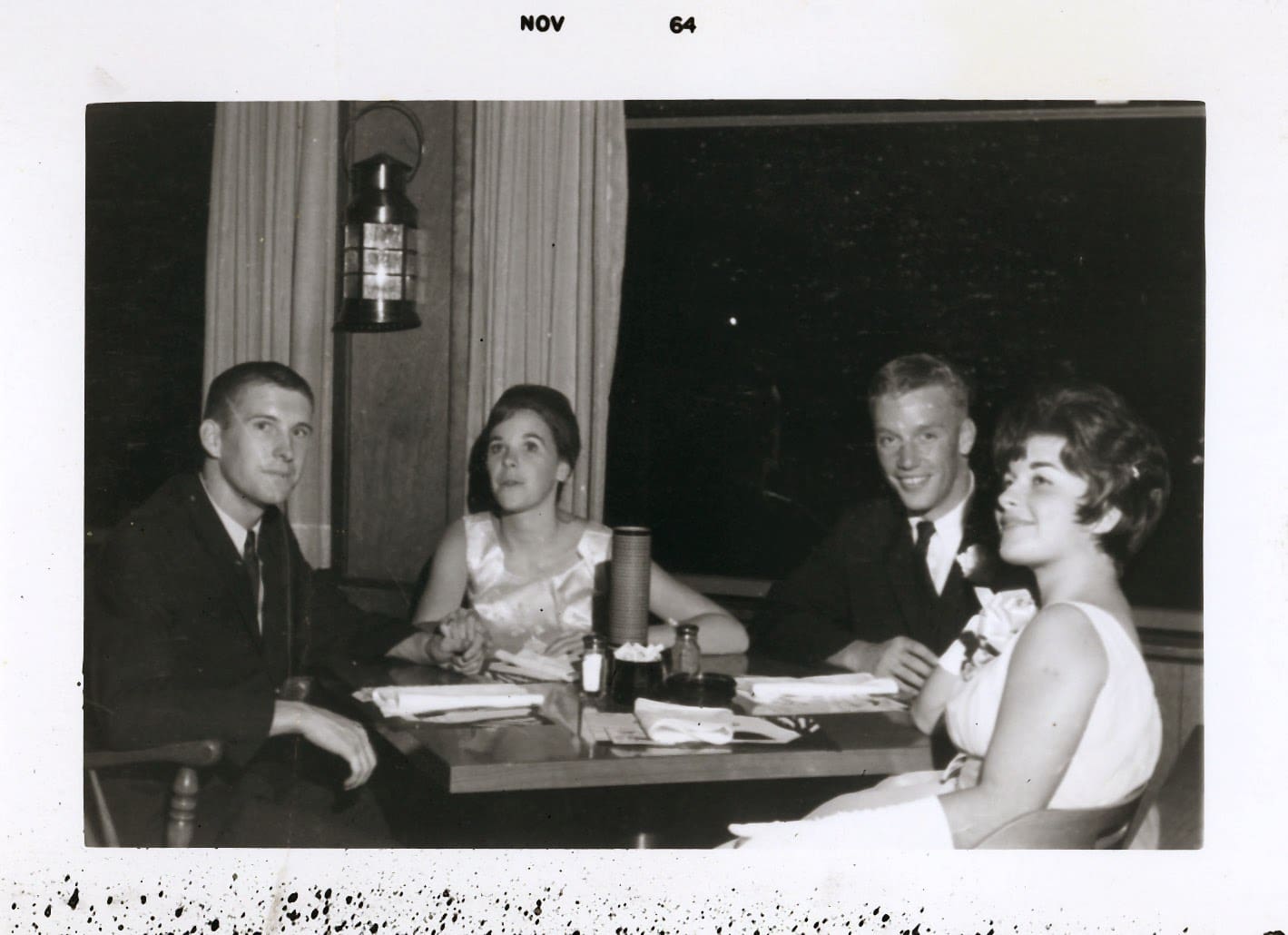 A group of people sitting at a table.