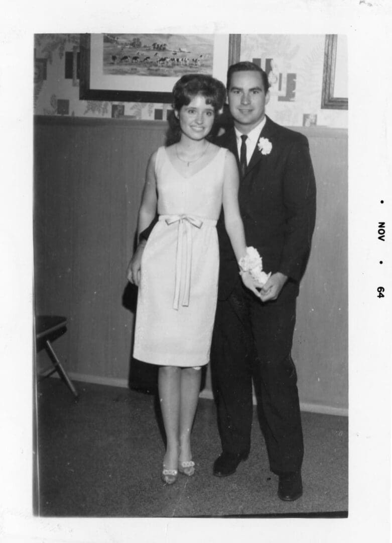 A man and woman standing next to each other.