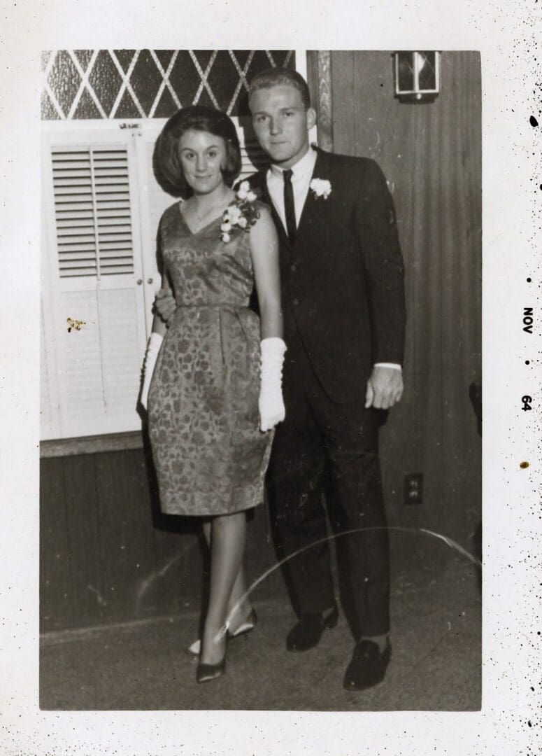 A man and woman pose for the camera.