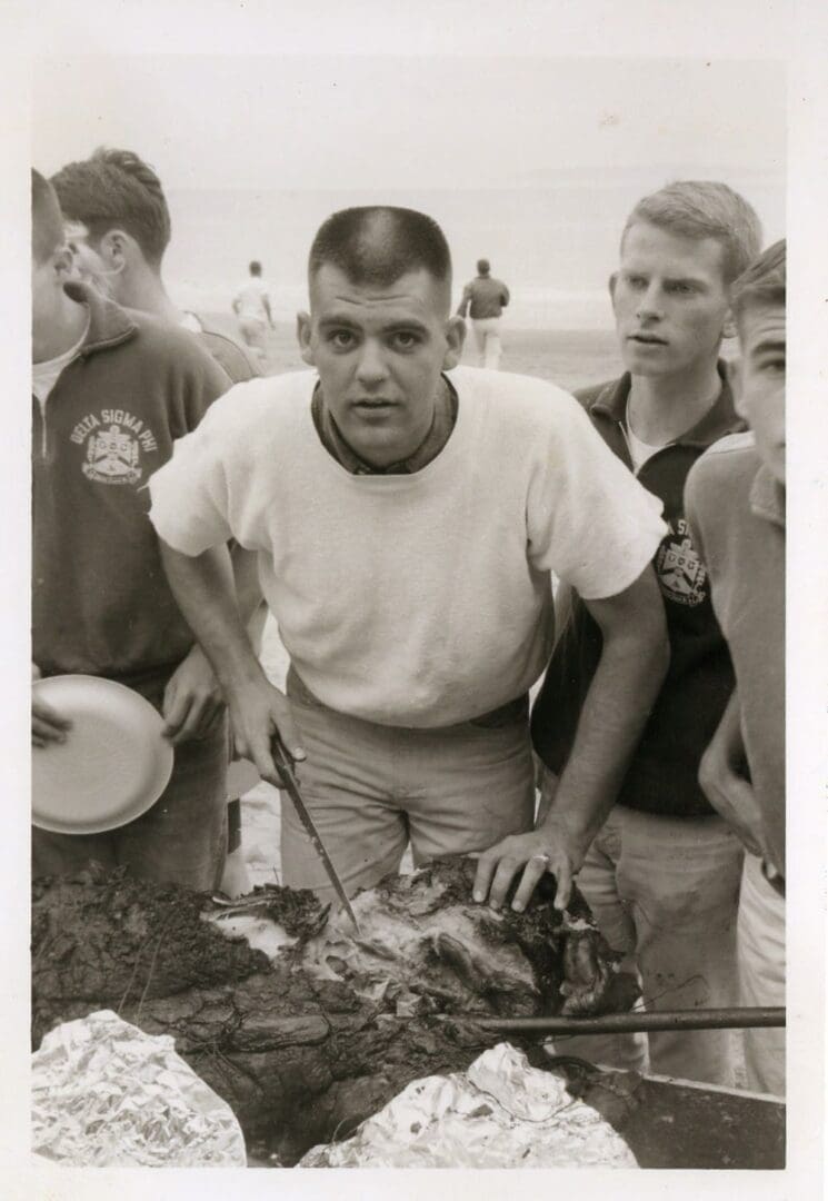 A man holding a turkey in front of several other men.