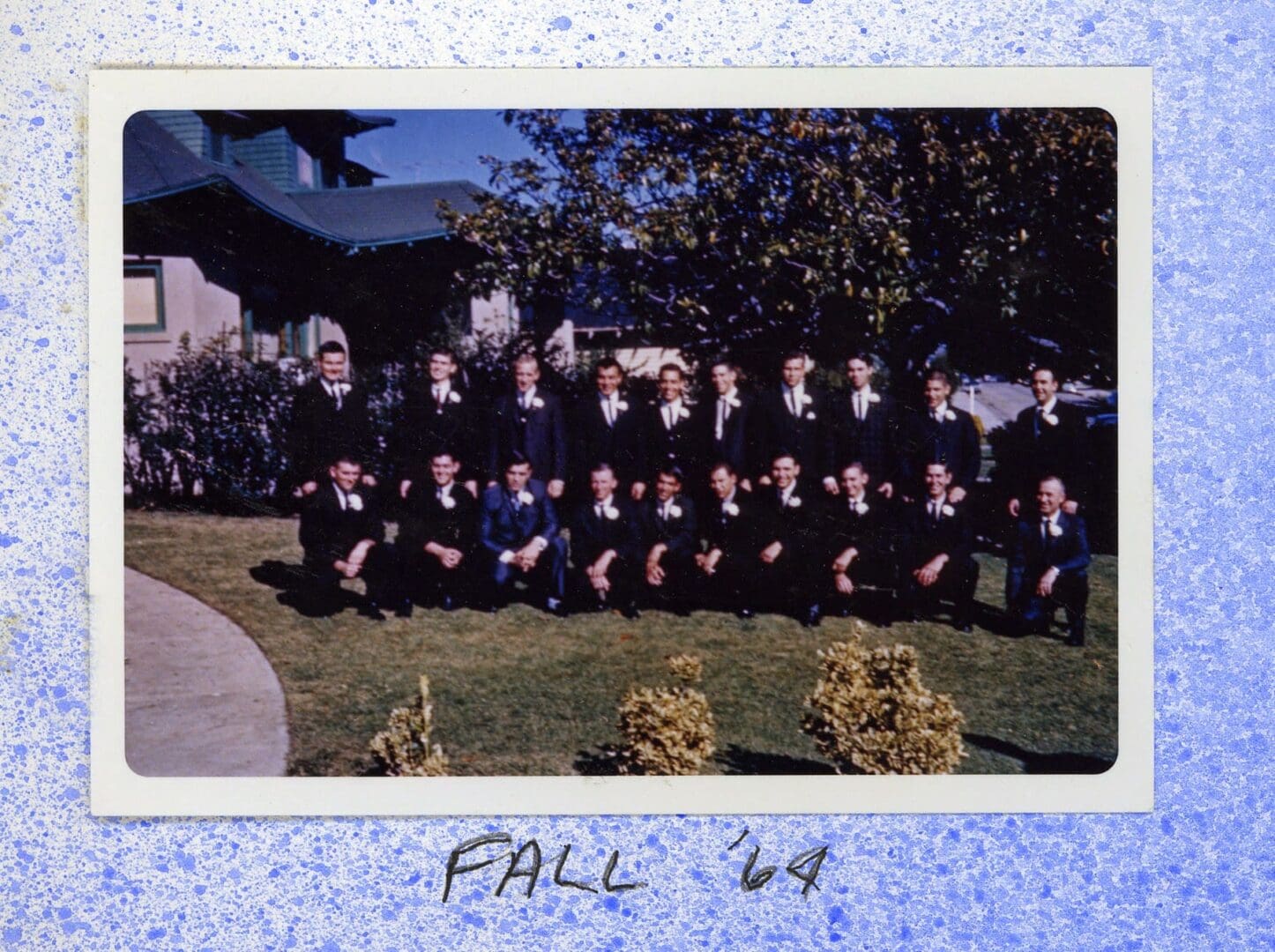 A group of people in black suits and hats.