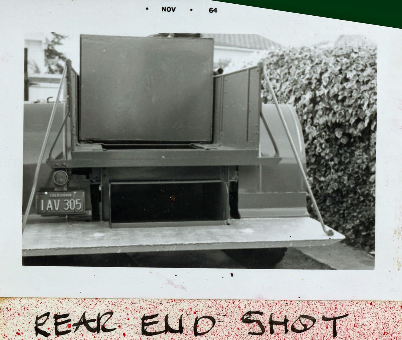 A black and white photo of an old television set.