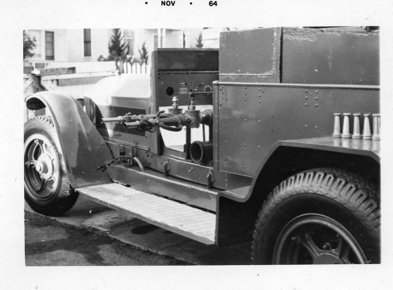 A black and white photo of an old truck.