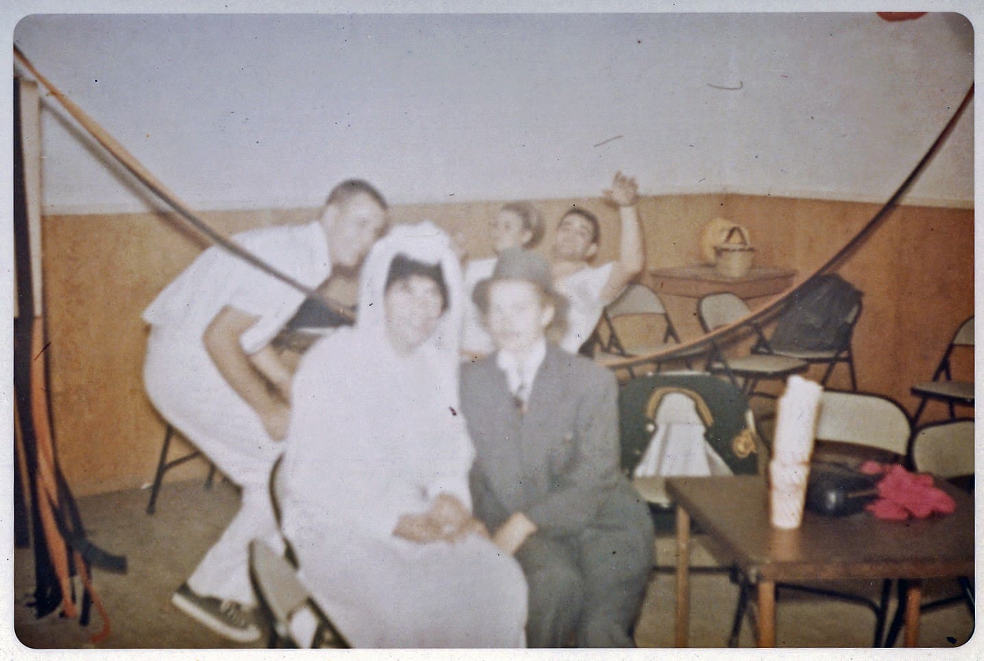 A group of people sitting in chairs and posing for the camera.