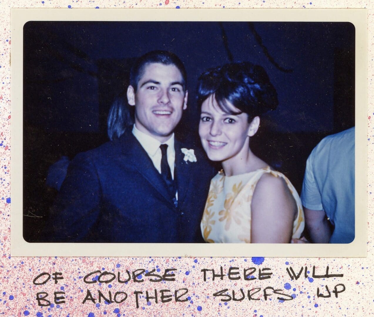 A young man and woman posing for a picture.