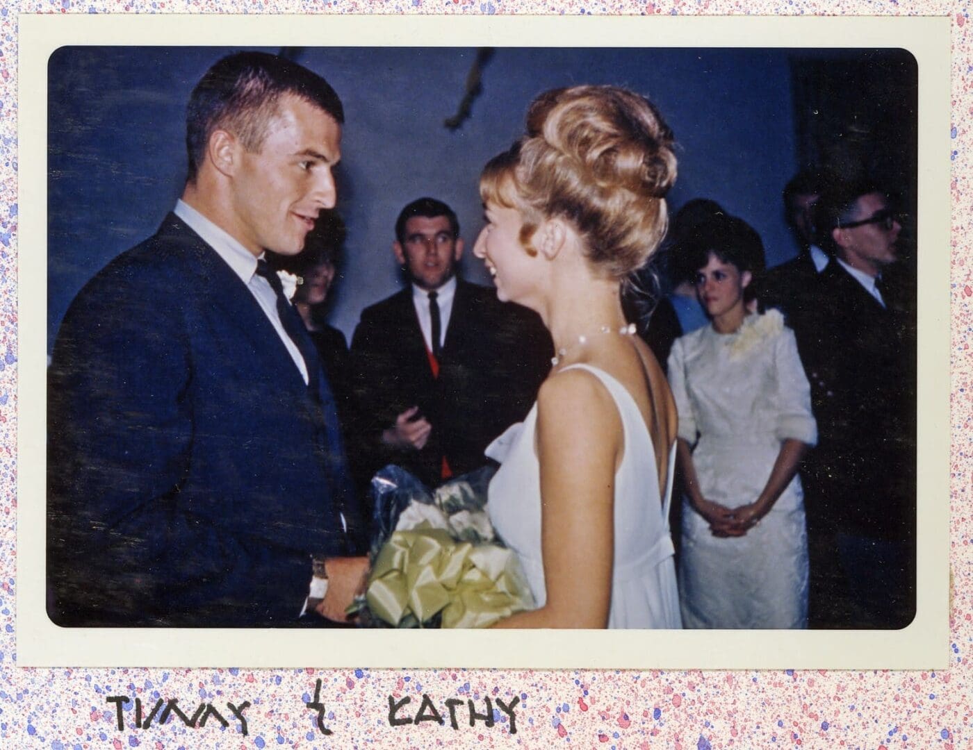 A man and woman are standing together at their wedding.