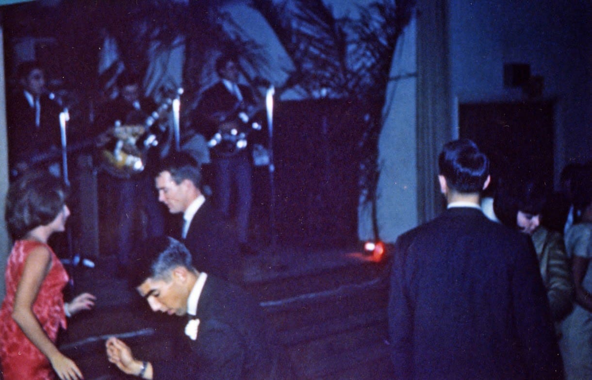 A group of men in suits and hats standing next to each other.