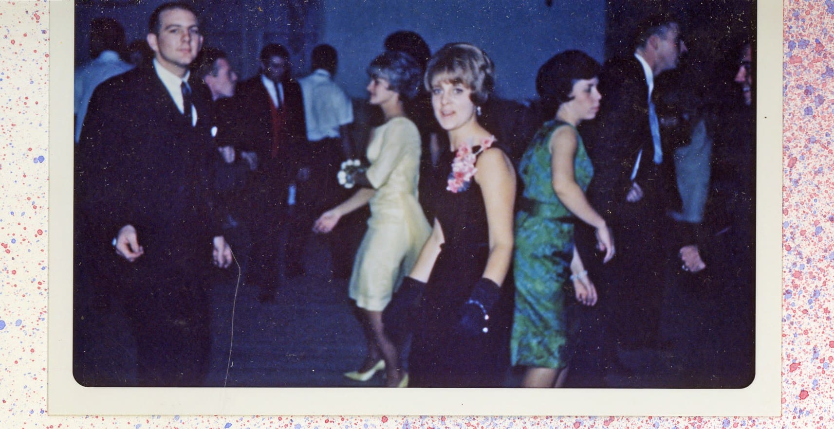 A group of women in dresses and heels dancing.