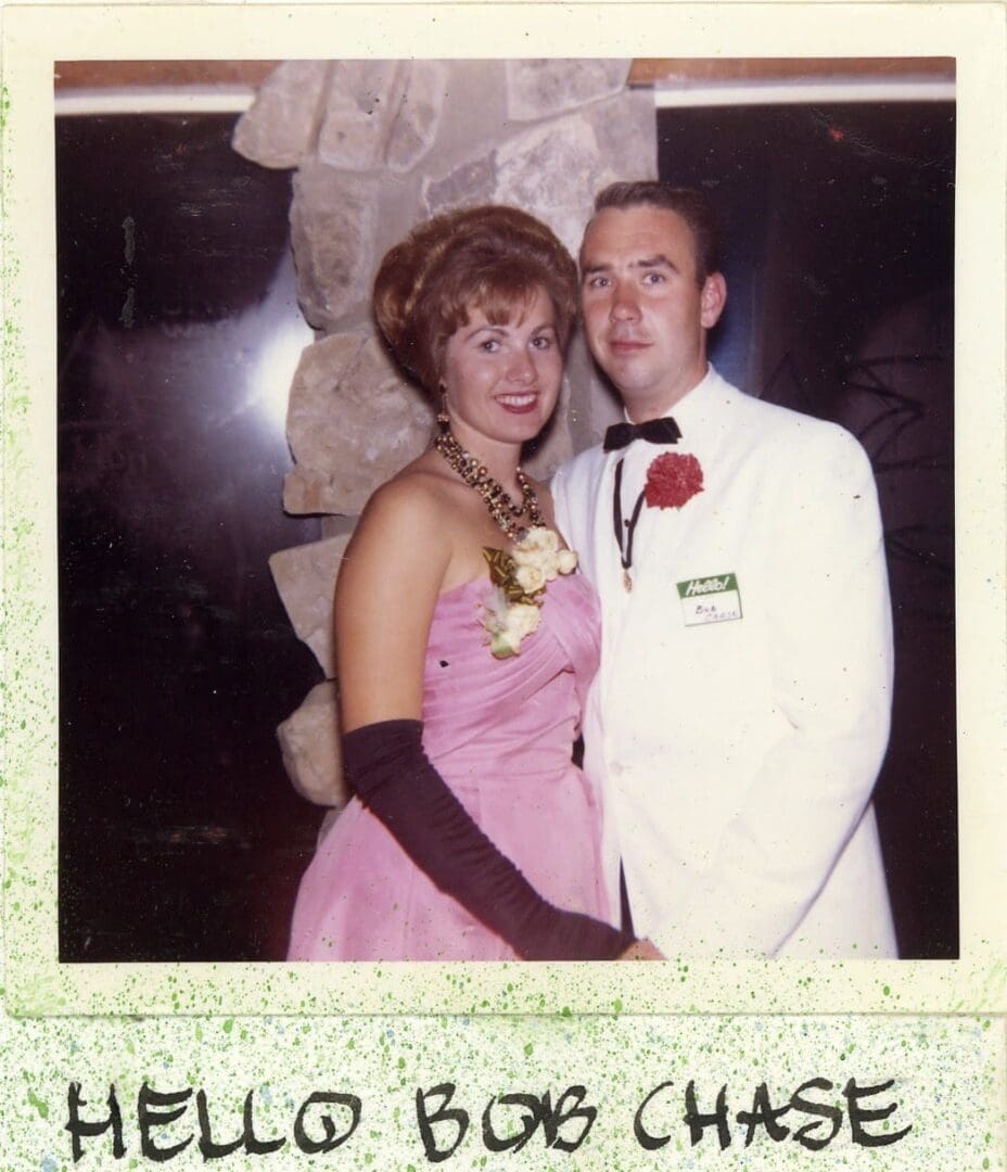 A man and woman dressed up for prom.