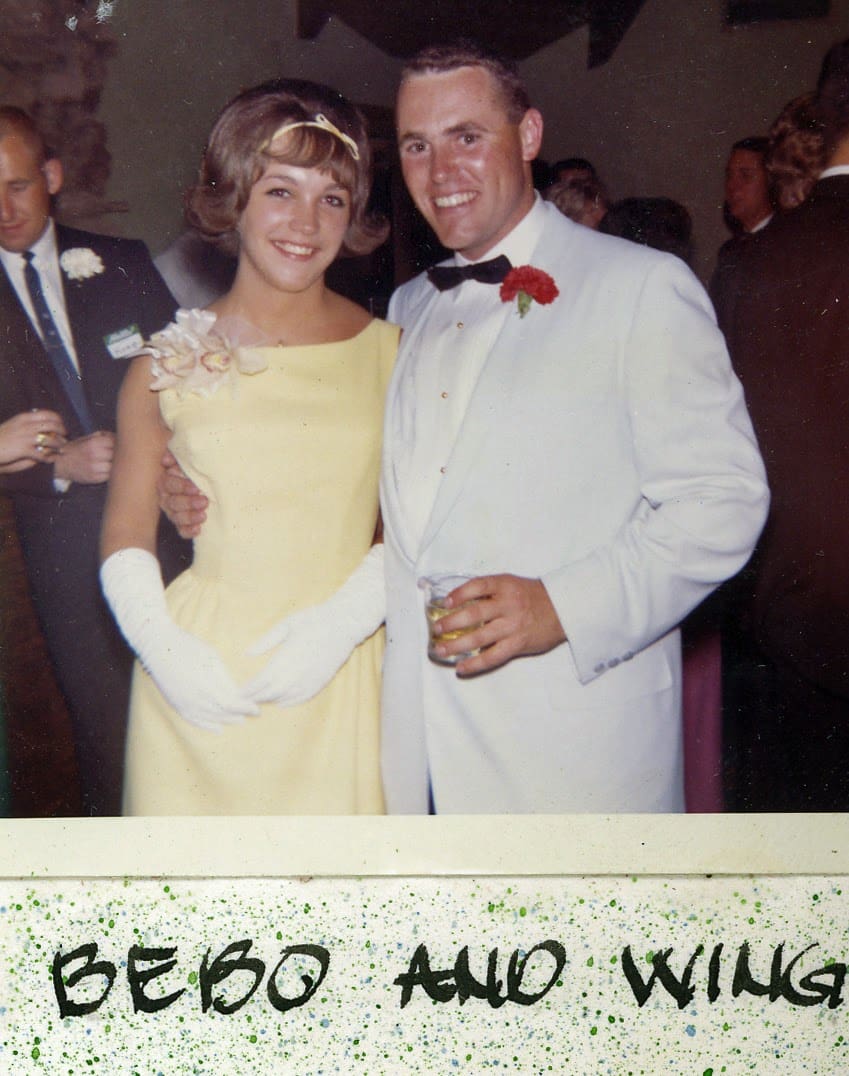 A man and woman dressed up for prom.