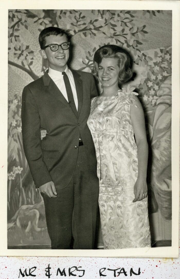 A man and woman posing for a picture.