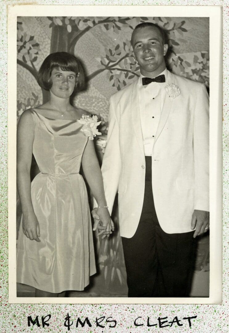 A man and woman dressed up in formal wear.