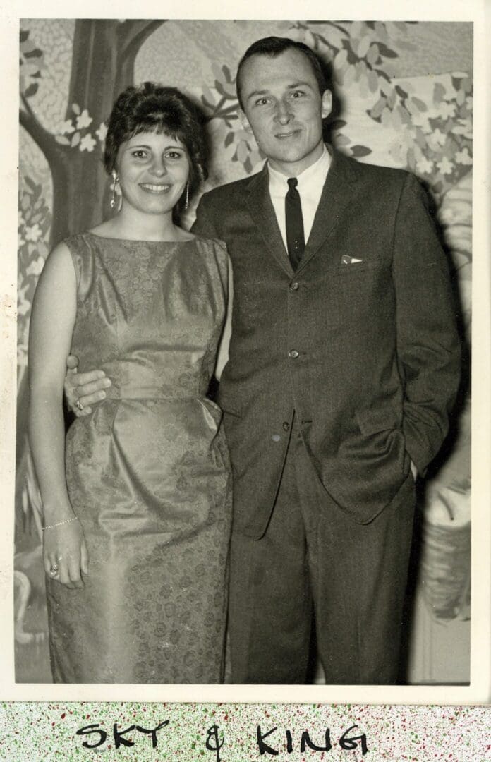 A man and woman posing for a picture.