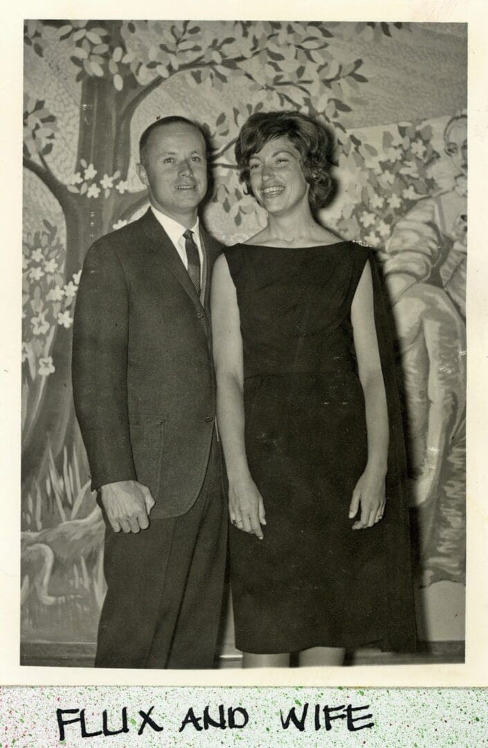 A man and woman standing next to each other.