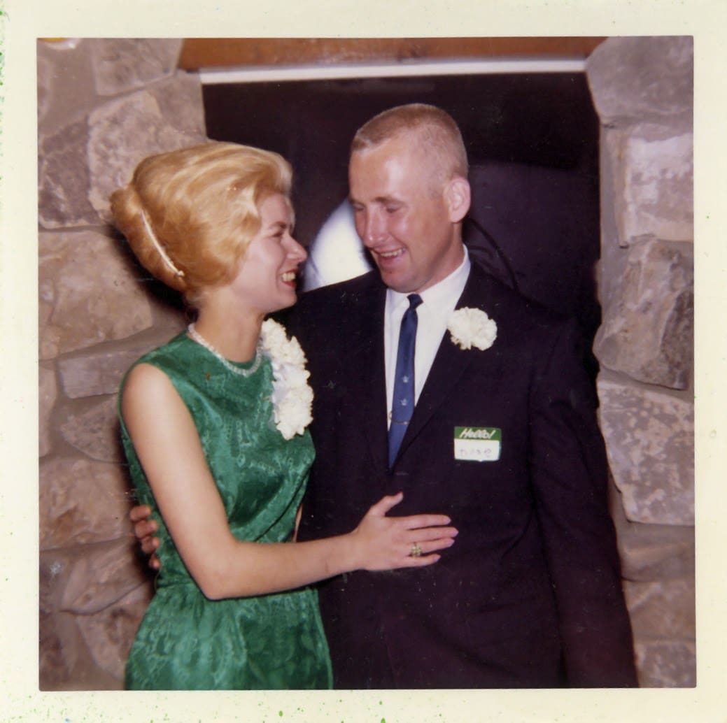 A man and woman standing next to each other.