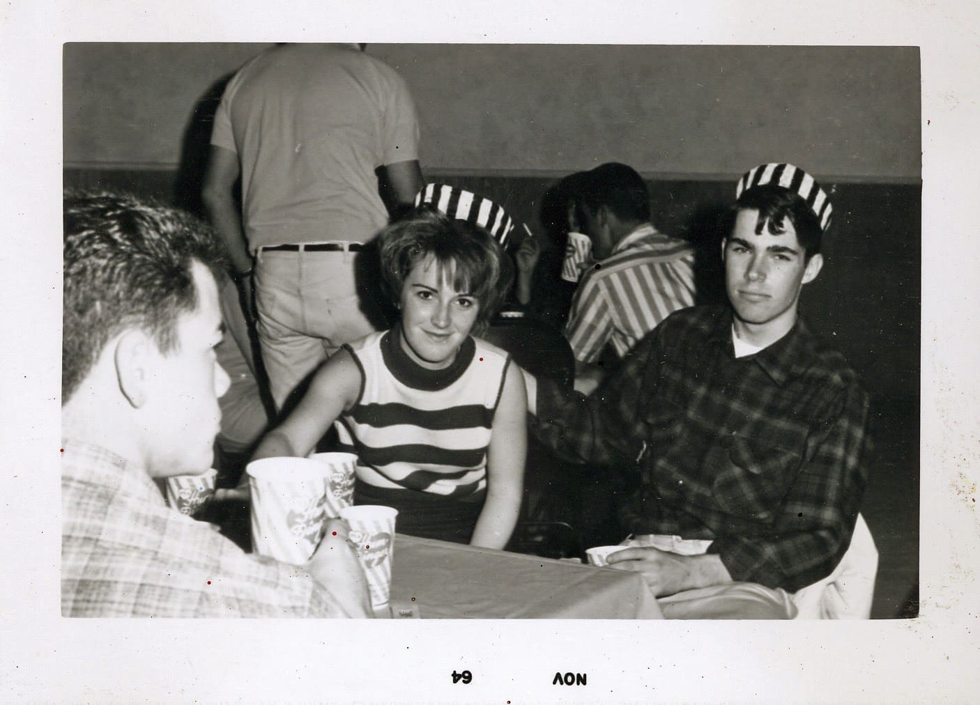 A group of people sitting around a table.