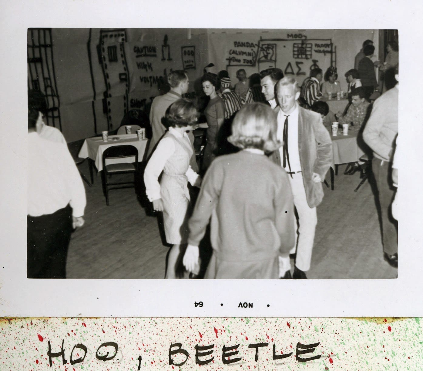A group of people dancing in a room.