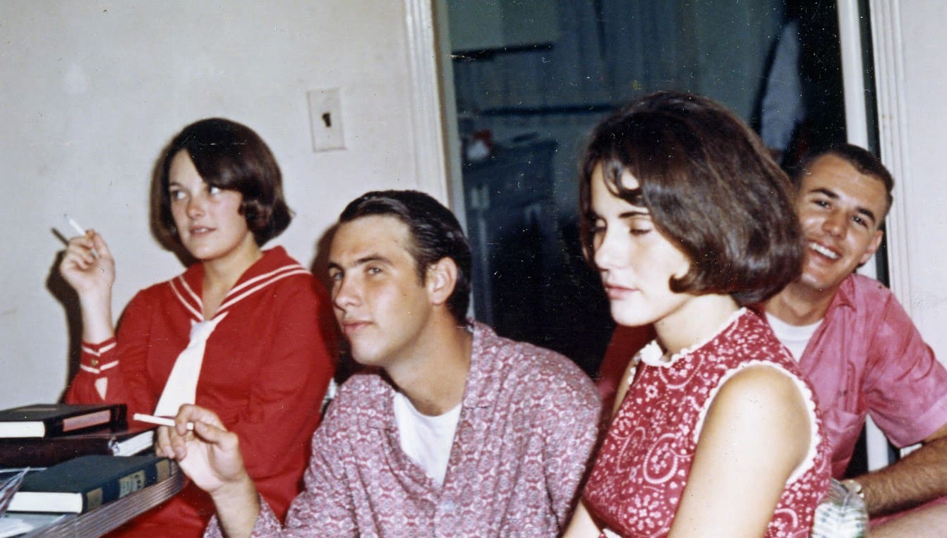 A group of people sitting in front of each other.