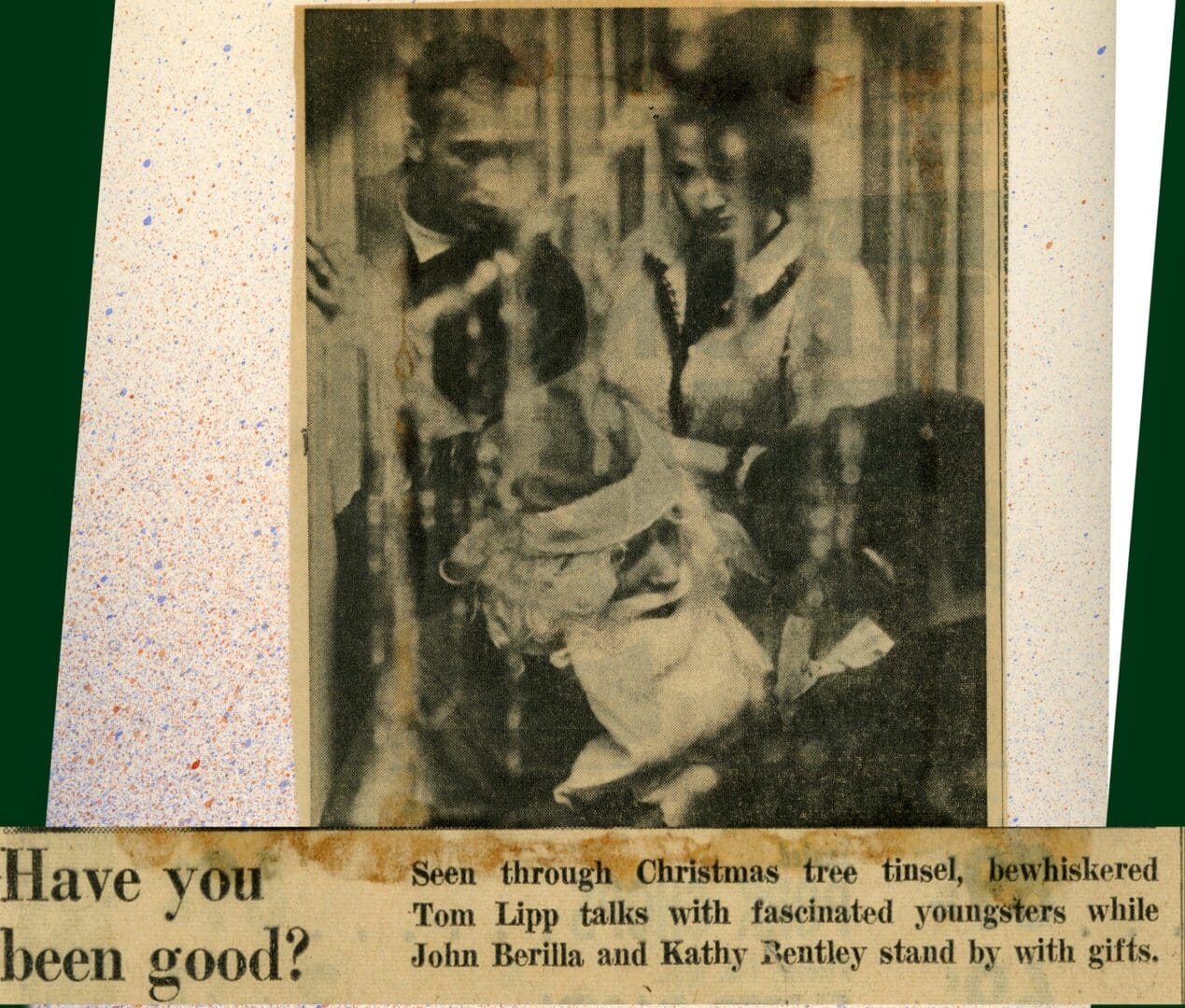 A newspaper clipping of two people sitting on the floor.