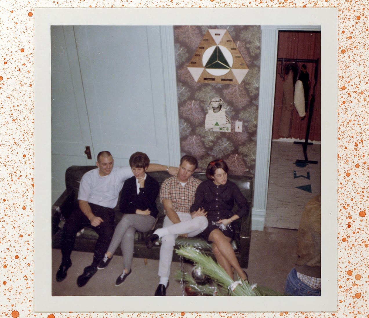 A group of people sitting on top of a couch.
