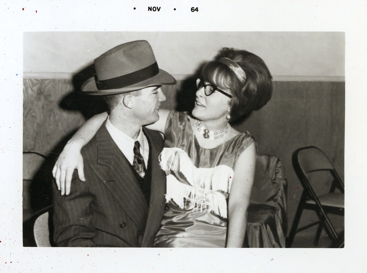 A man and woman are posing for the camera.