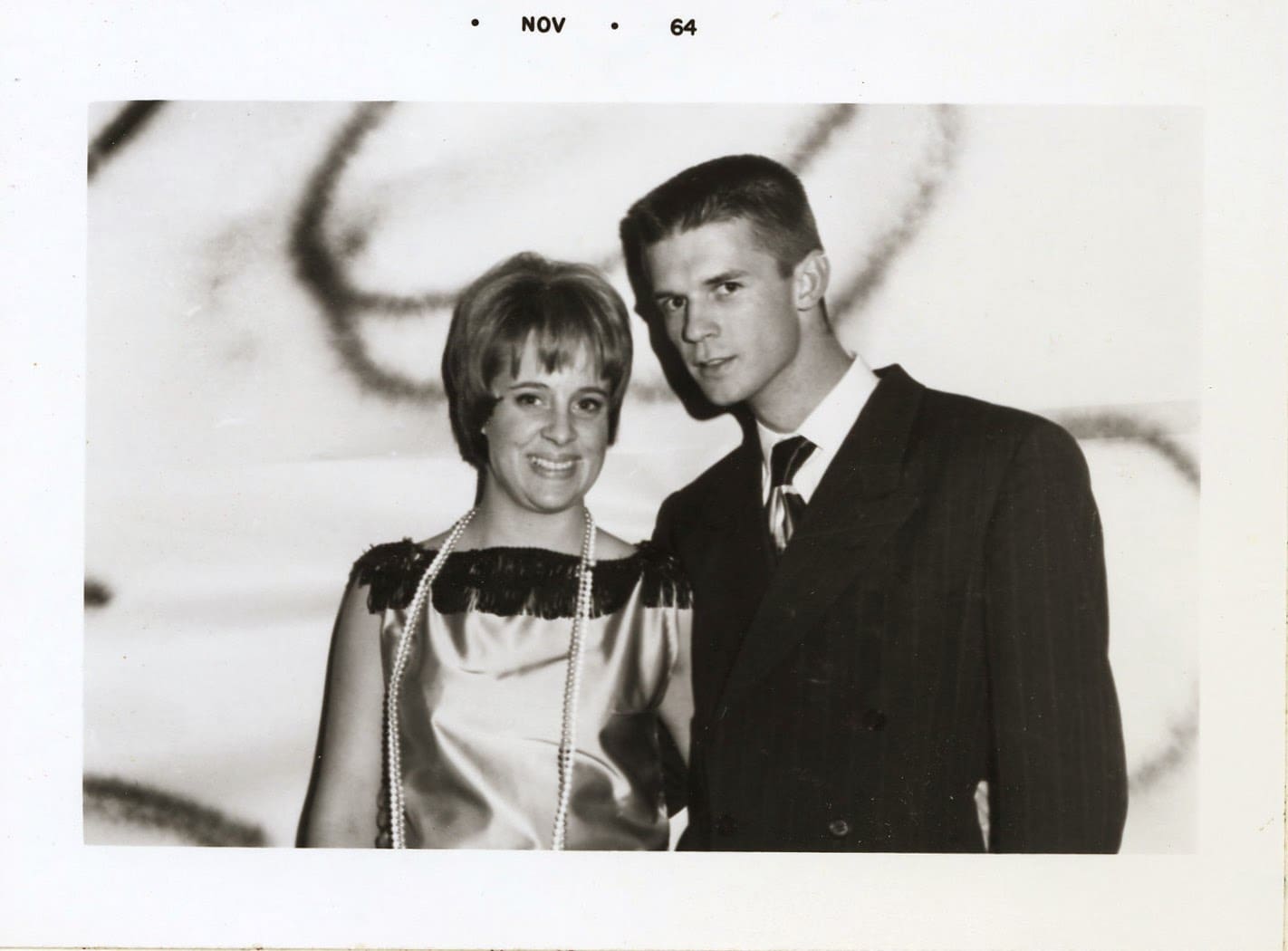 A man and woman posing for a picture.