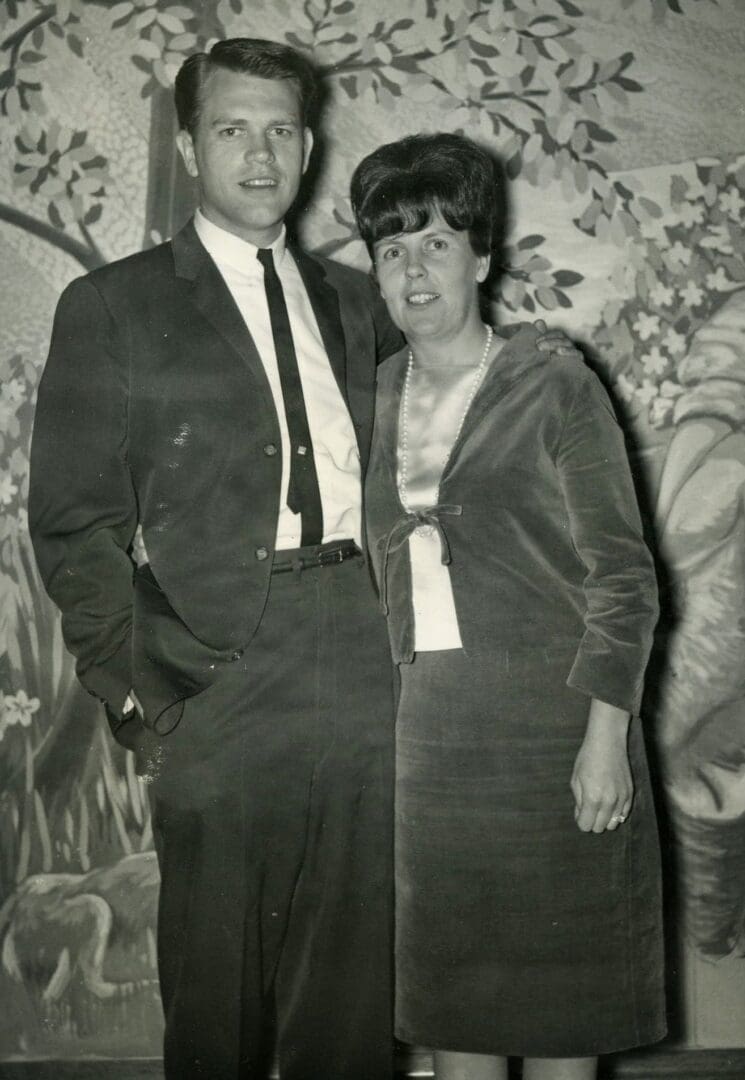 A man and woman standing next to each other.