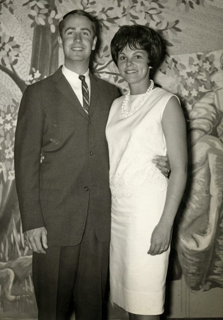A man and woman standing next to each other.