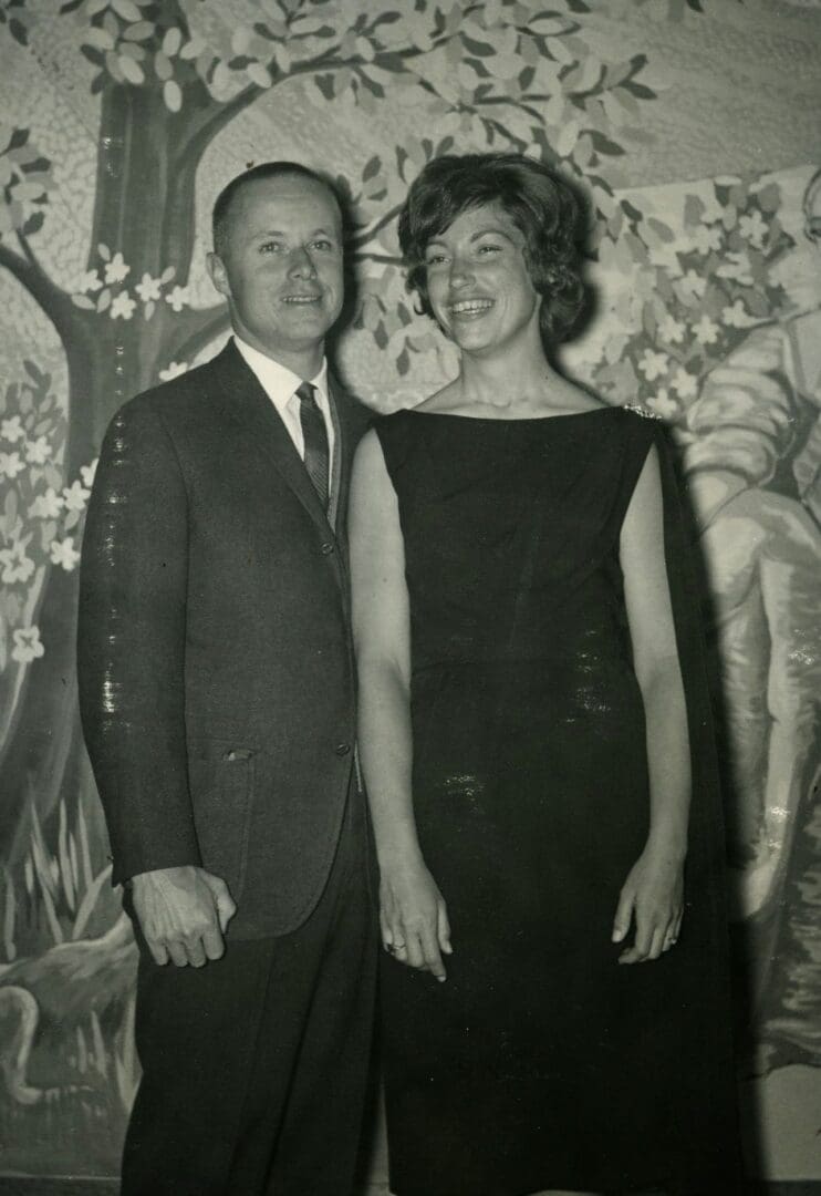 A man and woman standing next to each other.