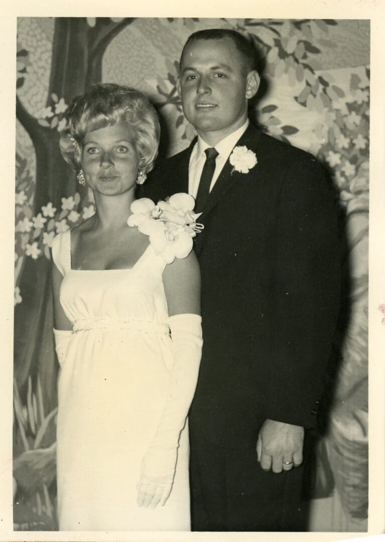 A man and woman standing next to each other.