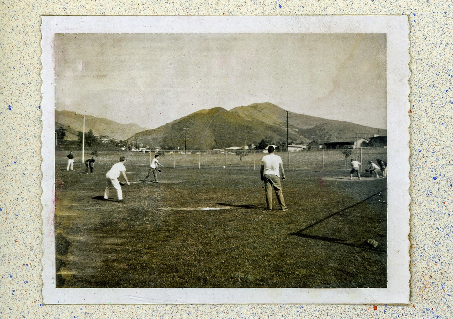A group of men playing baseball on the field.