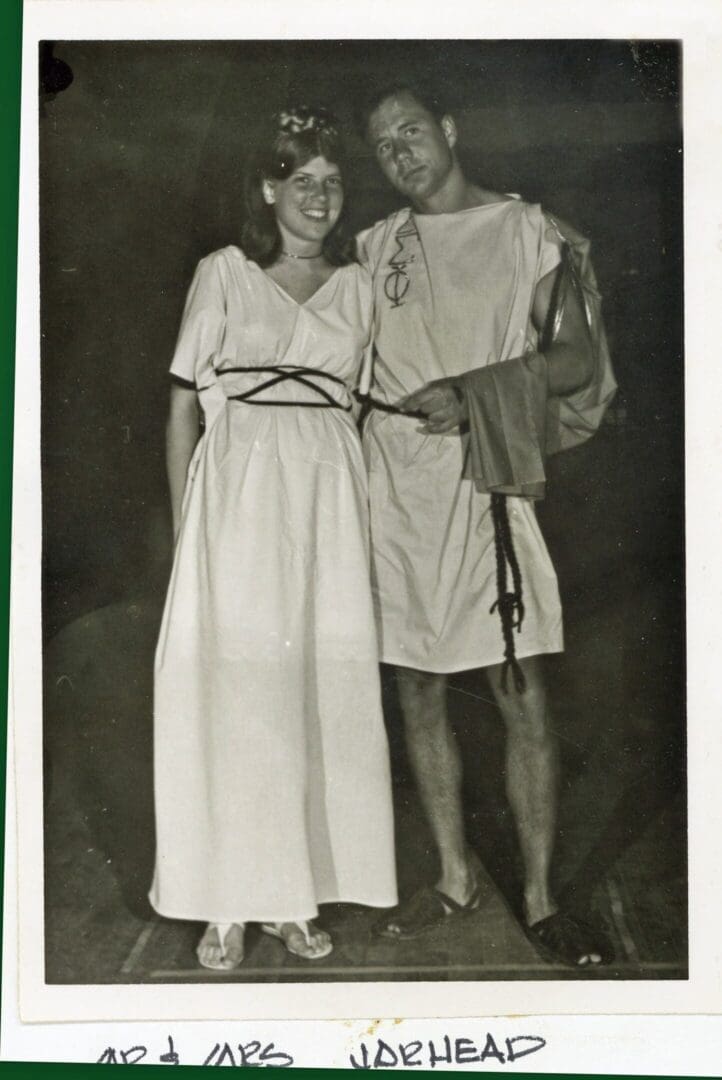 A man and woman dressed as roman soldiers.